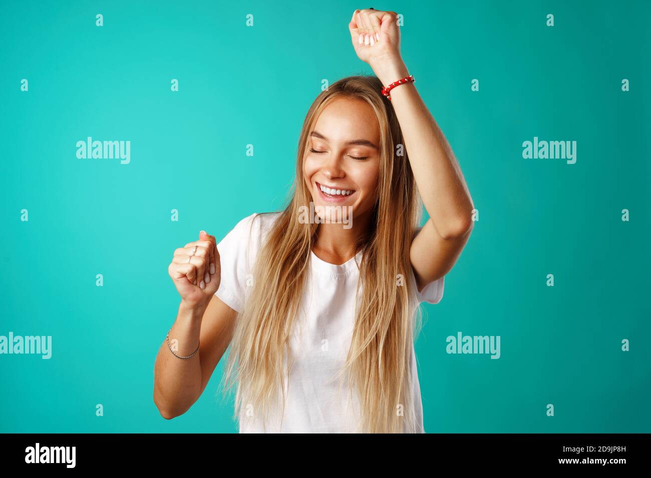 Happy joyful smiling young woman celebrating success Stock Photo - Alamy