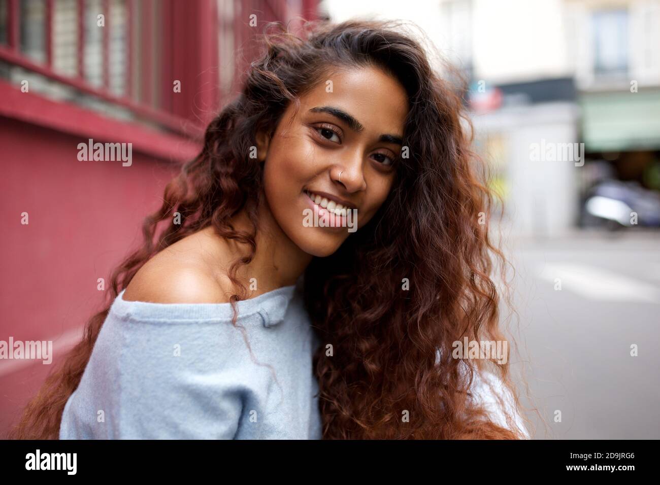 Close up portrait beautiful young Indian woman with long hair smiling ...