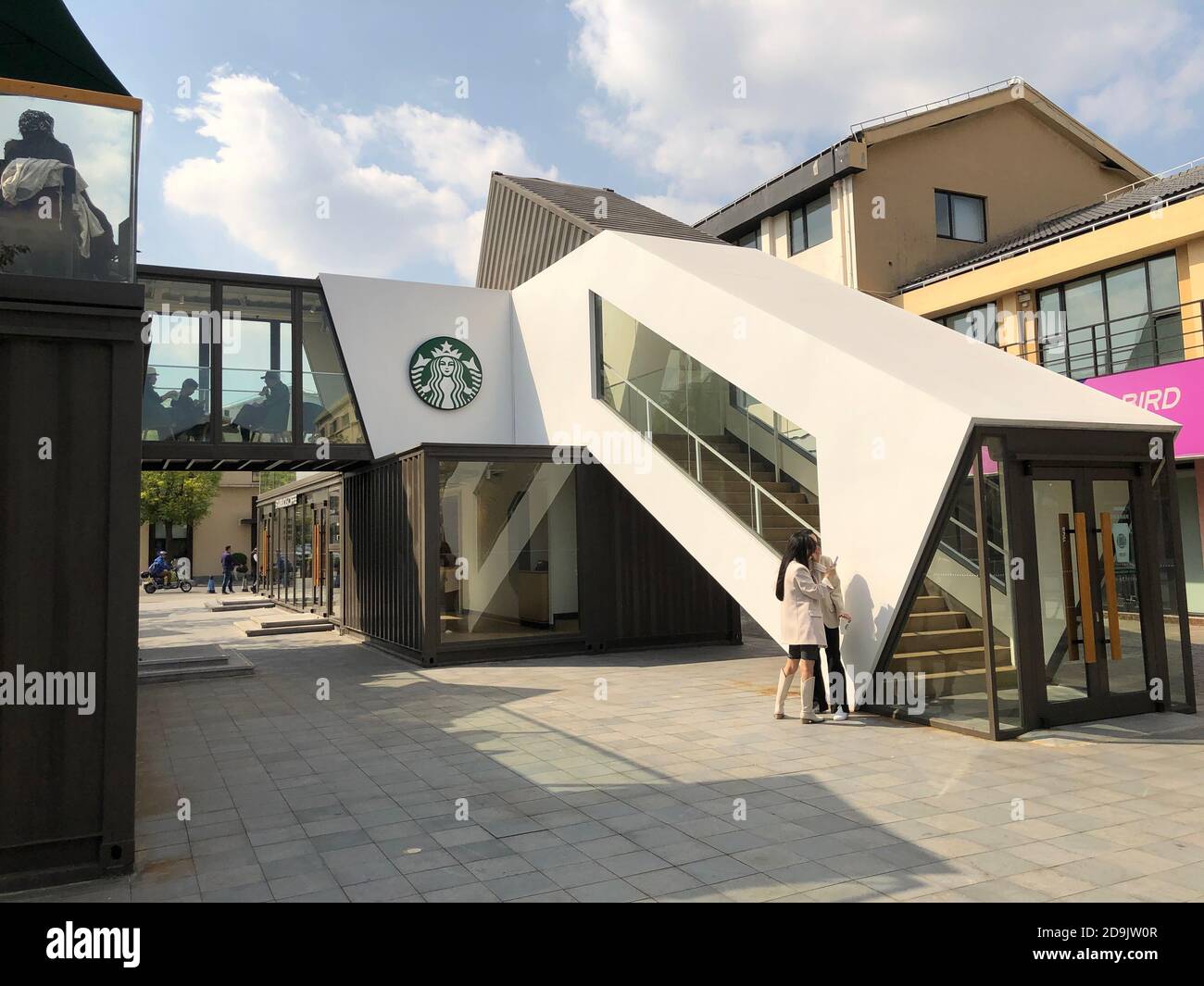 People Pose For Photos With The First Starbucks Container Concept Store In Baoshan District In Shanghai China 24 October Stock Photo Alamy
