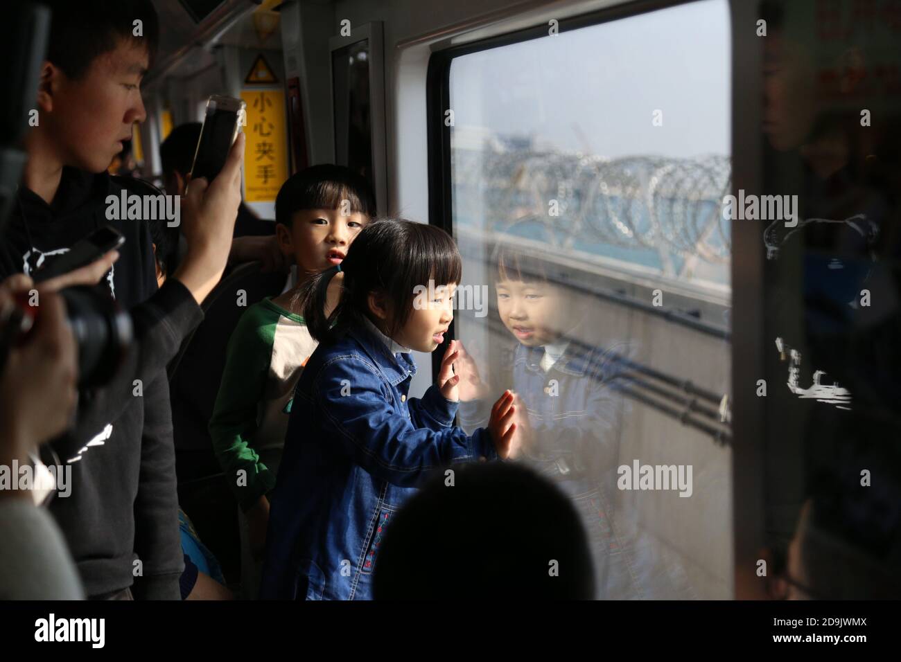 --FILE--Passengers take the newly opened line 1 of the municipal metro ...