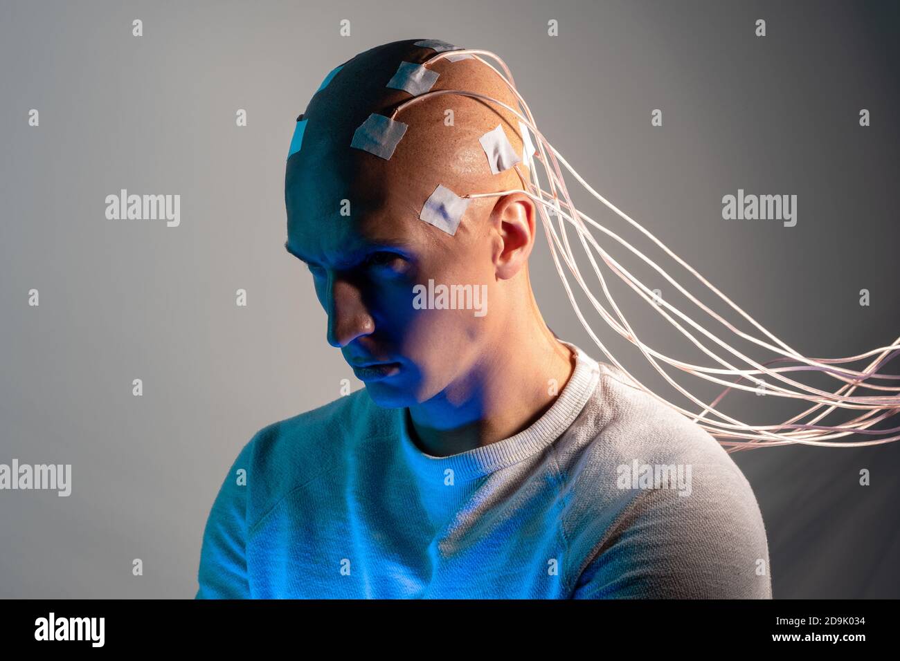 Man with electrodes in his head is a futuristic concept of virtual