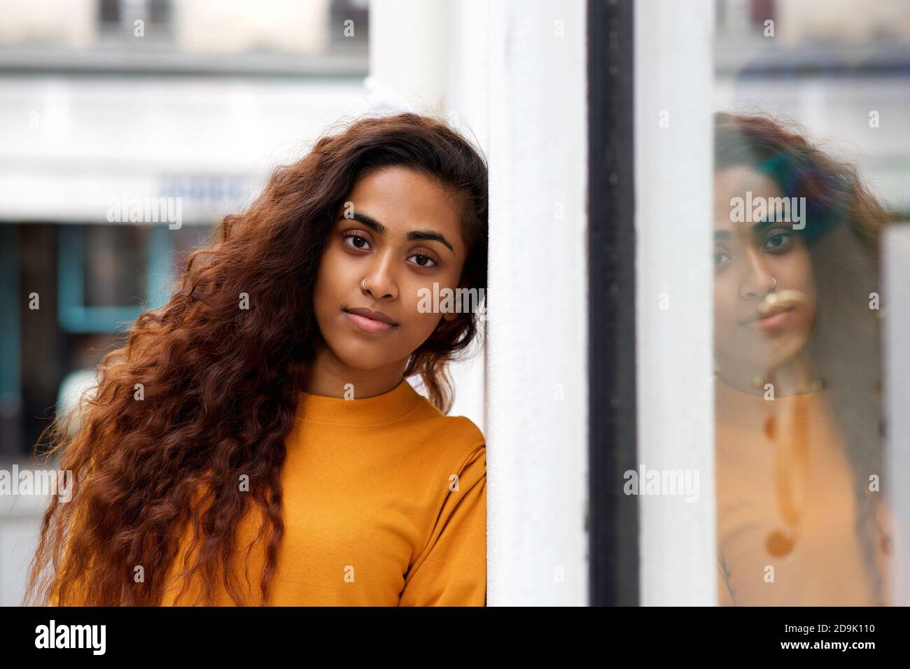 Close up portrait beautiful young indian woman with long hair leaning ...