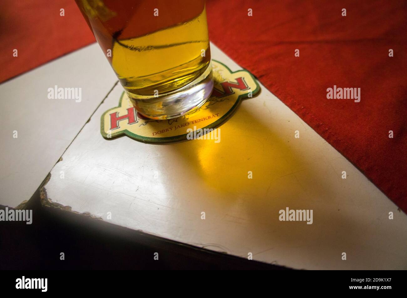 light lager Hostan, drink coaster, beverage coaster, beermat, beer glass, half litre, HPL, high-pressure laminate table, retro pub, restaurant, Czech Stock Photo