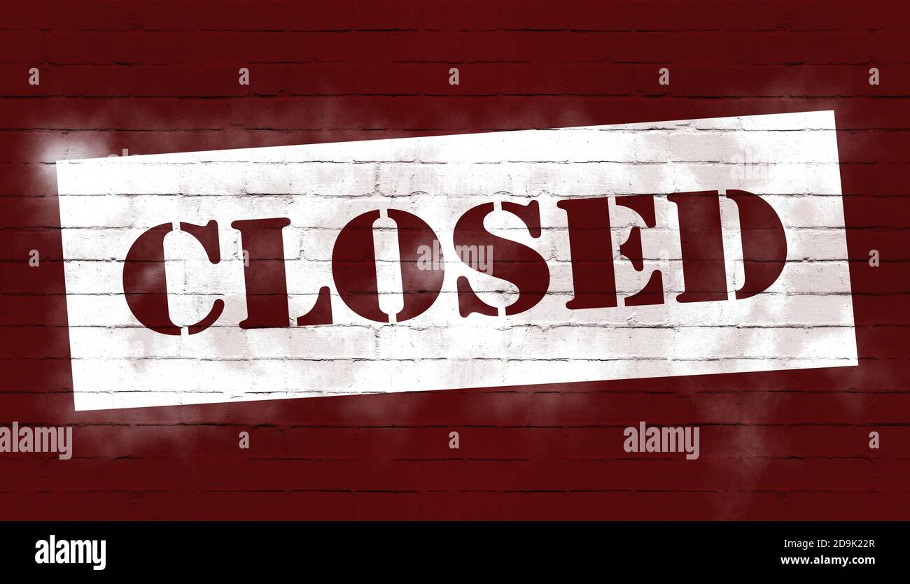 word CLOSED spray painted on red stone wall, closed business concept Stock Photo