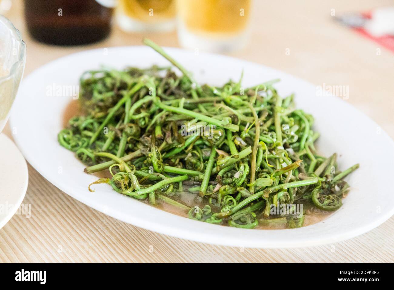 Fried pucuk paku or midin, delicacy vegetable in Sarawak Stock Photo