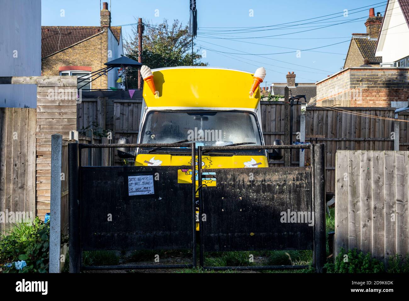 Ice cream van parked in rear garden of private property during COVID 19 lockdown 2 period. Lost business. Self employed business affected by virus Stock Photo