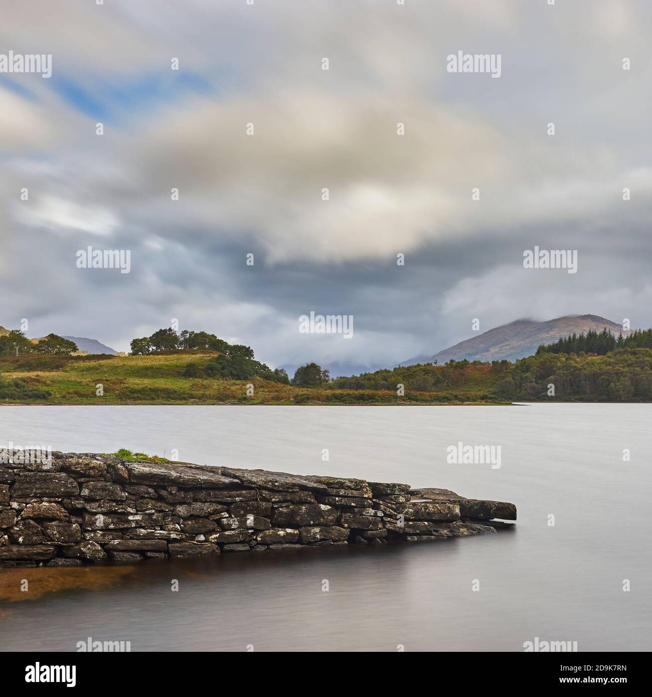Old stone jetty on Loch Shiel, near Dalelia, Moidart, Lochaber, Highland, Scotland. Stock Photo