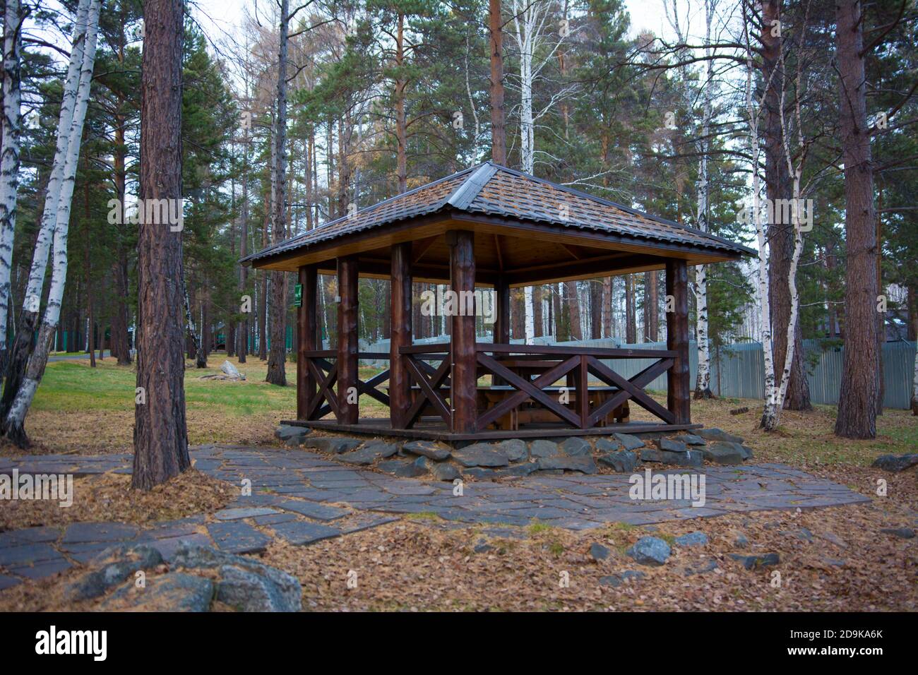 a brown wooden gazebo for relaxing in the forest Stock Photo - Alamy