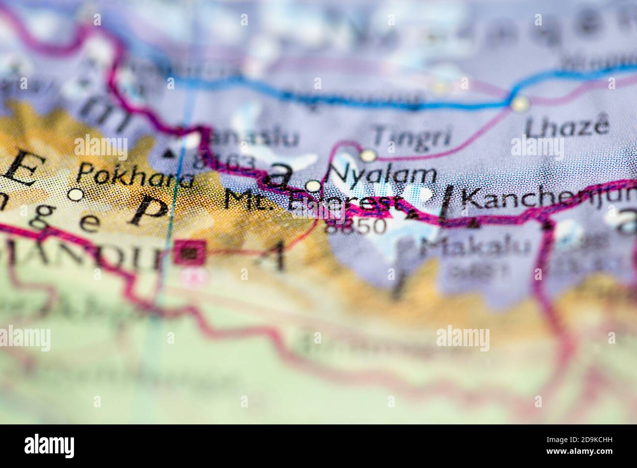 Shallow depth of field focus on geographical map location of Mount Everest in Nepal Asia continent on atlas Stock Photo