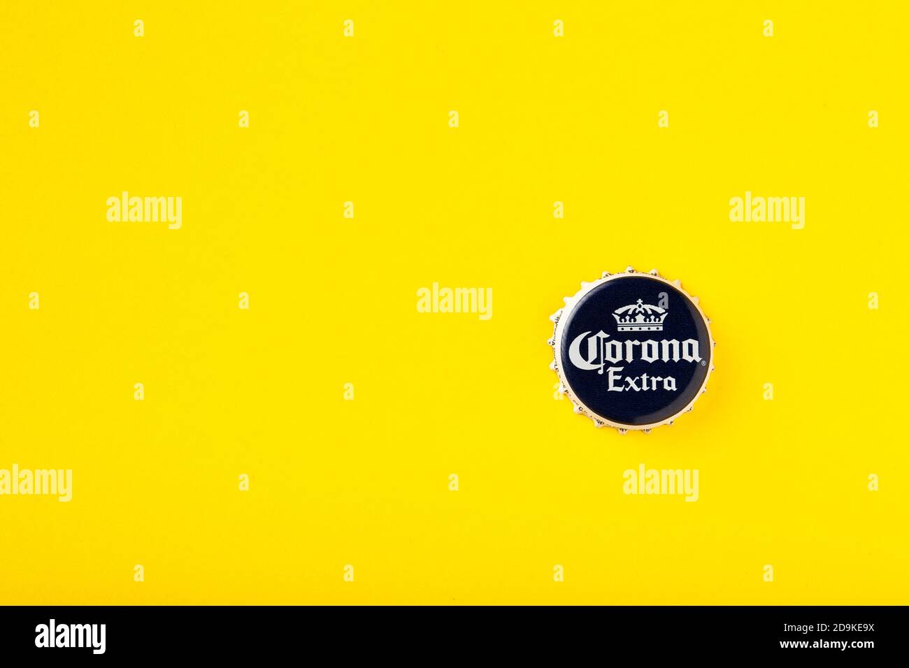 Cap of Corona Extra beer close up. Corona Extra Beer On yellow background. Corona is made in Mexico and is the top selling imported beer in the United Stock Photo