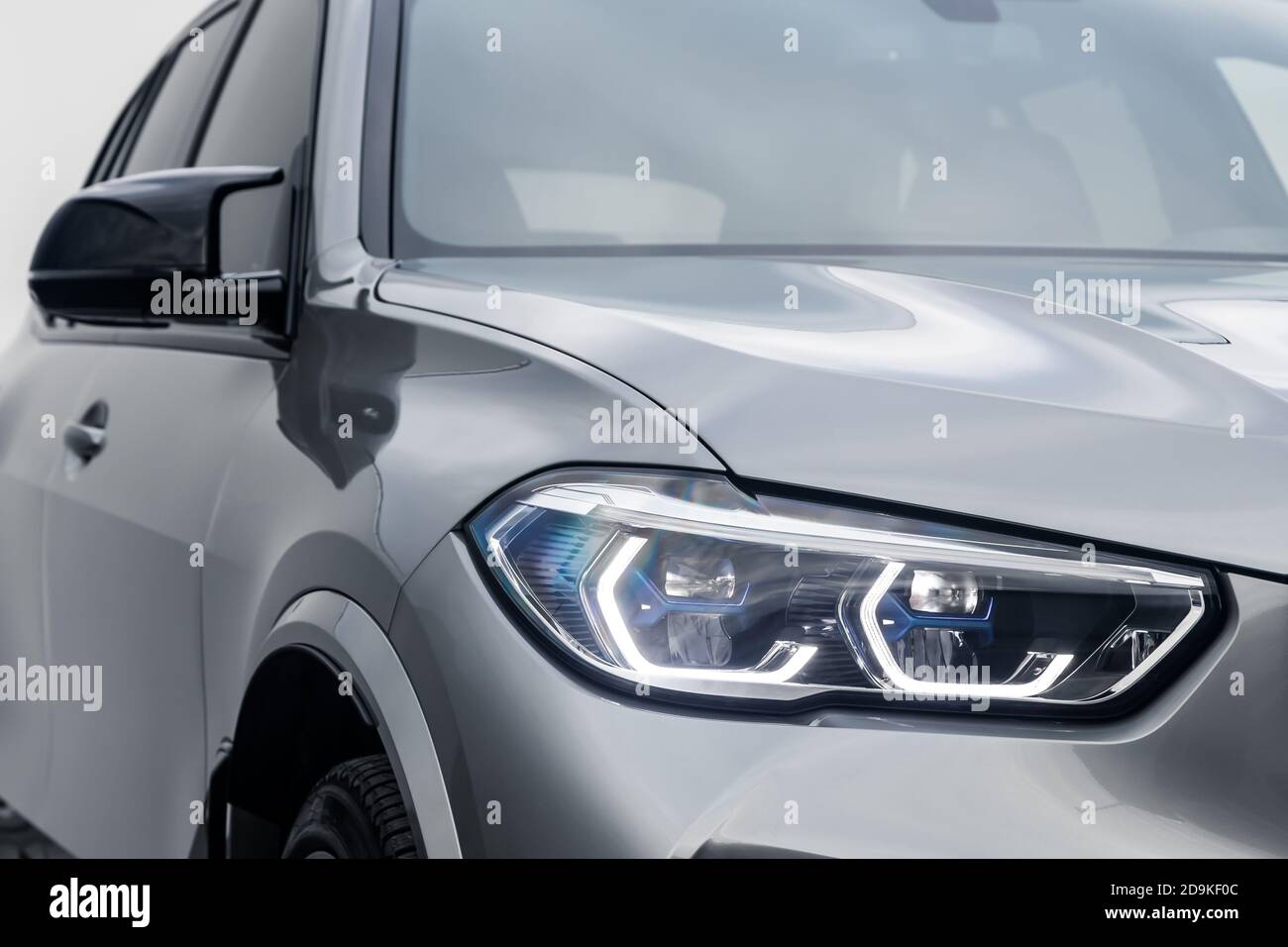 Mockup, banner for car advertising. Silver new car front view xenon