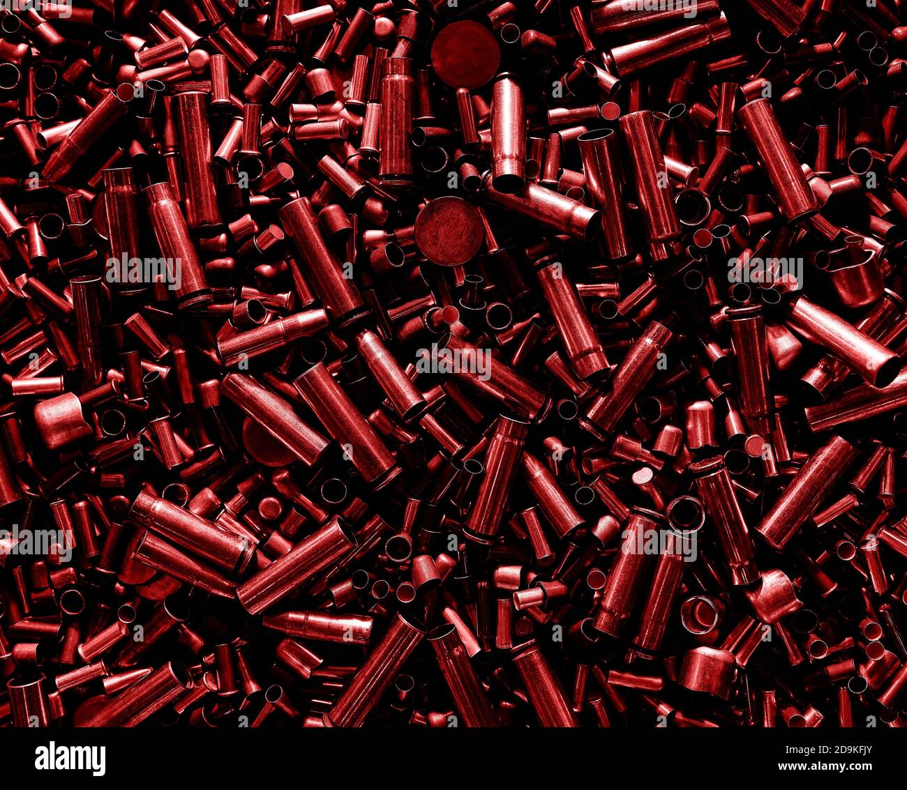 Different size bullet shells on the black ground. War concept