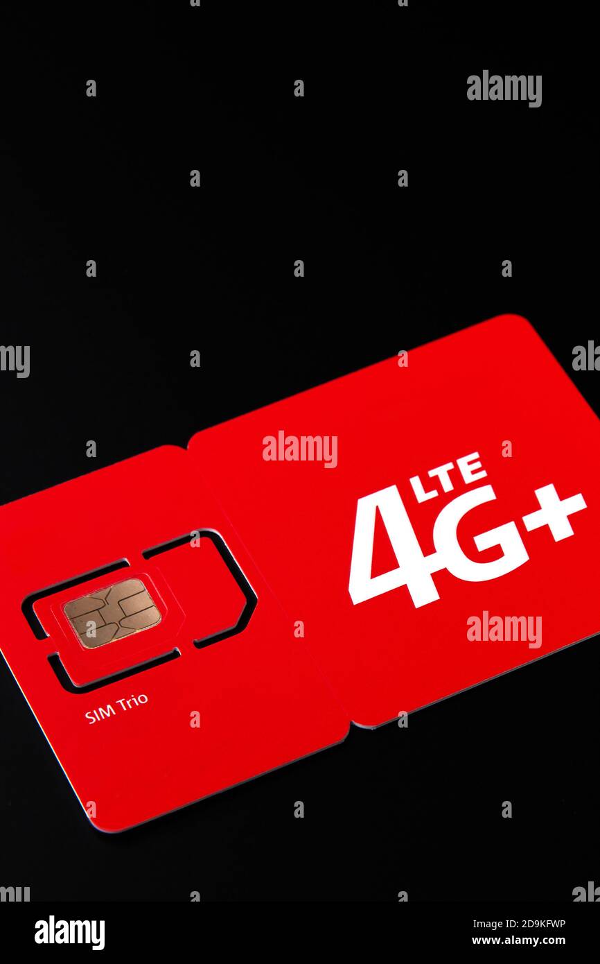 Size of sim card. Standard, micro and nano SIM card. SIM card for phone piled on a black background. Stock Photo