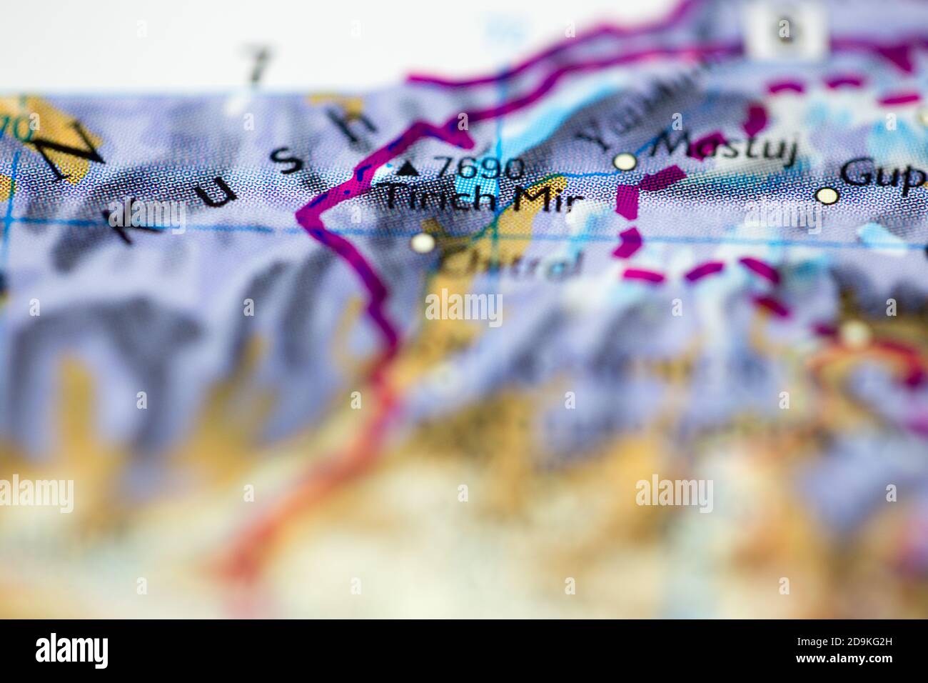 Shallow depth of field focus on geographical map location of Mount Tirich Mir in Pakistan Asia continent on atlas Stock Photo