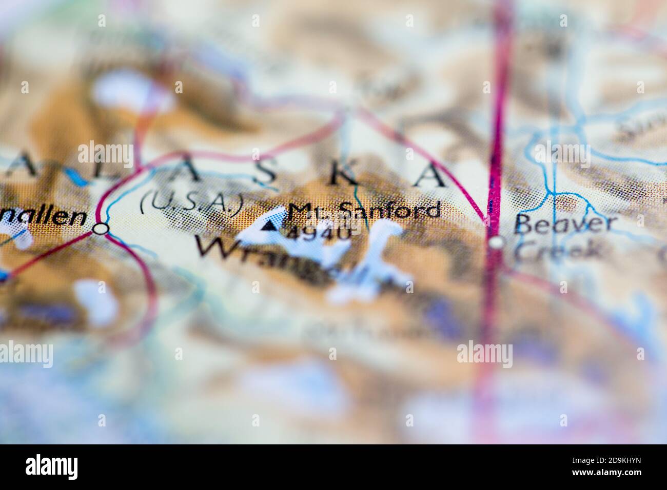 Shallow depth of field focus on geographical map location of Mount Sanford in United States North America continent on atlas Stock Photo