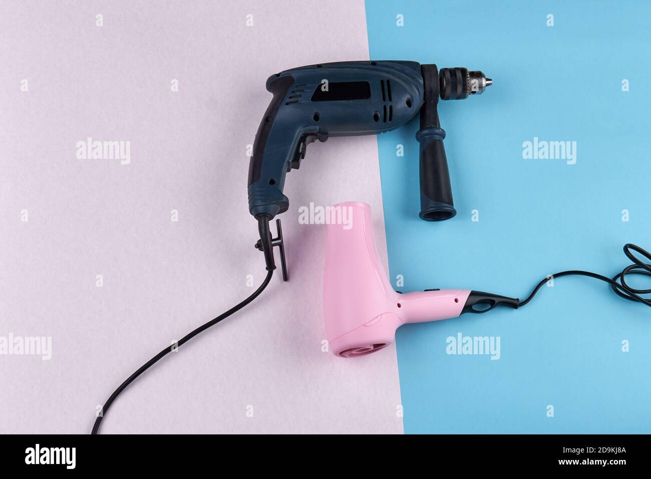 Power drill and hair dryer on colored background Stock Photo Alamy