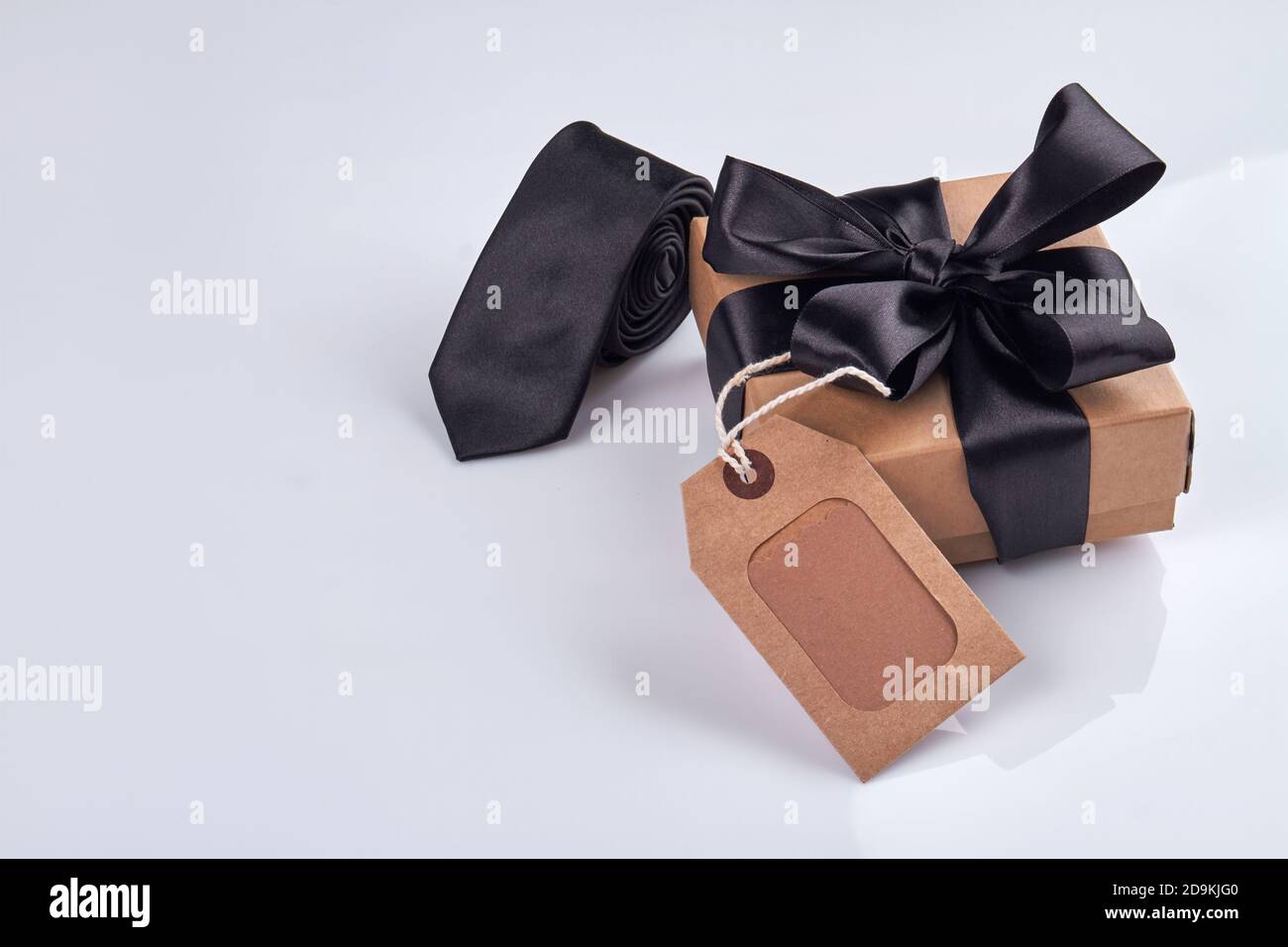 Gift box with red ribbon isolated on white Stock Photo - Alamy