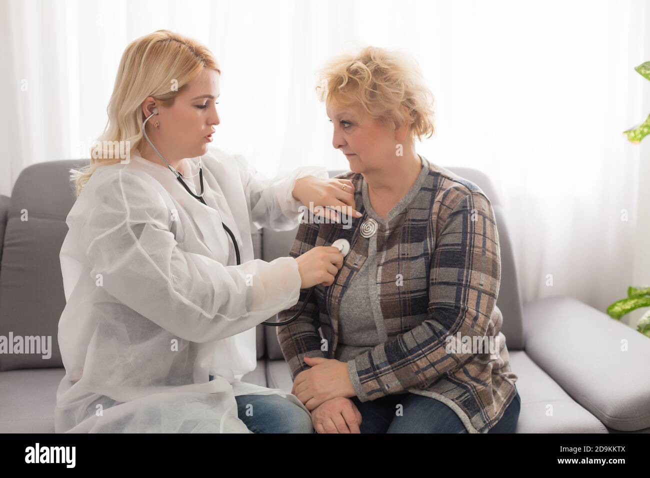Old woman and the sweet young doctor Stock Photo - Alamy
