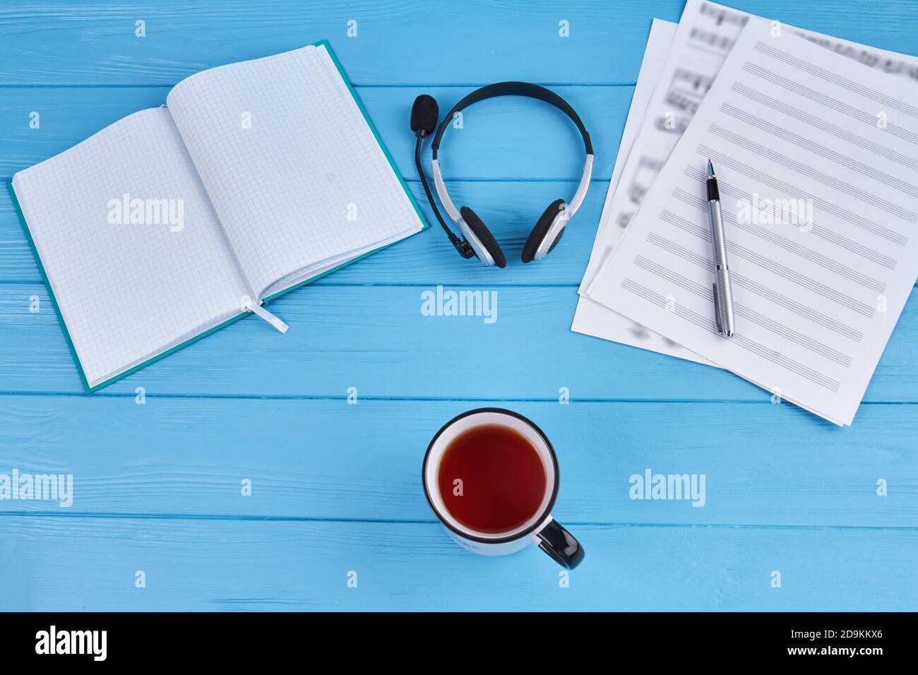 Songwriters workdesk with cup of tea. Stock Photo