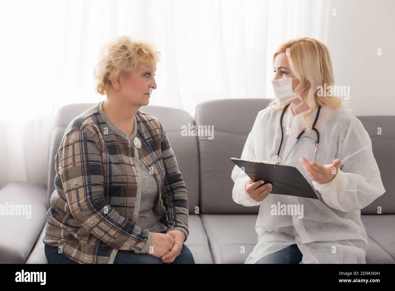 Old woman and the sweet young doctor Stock Photo - Alamy