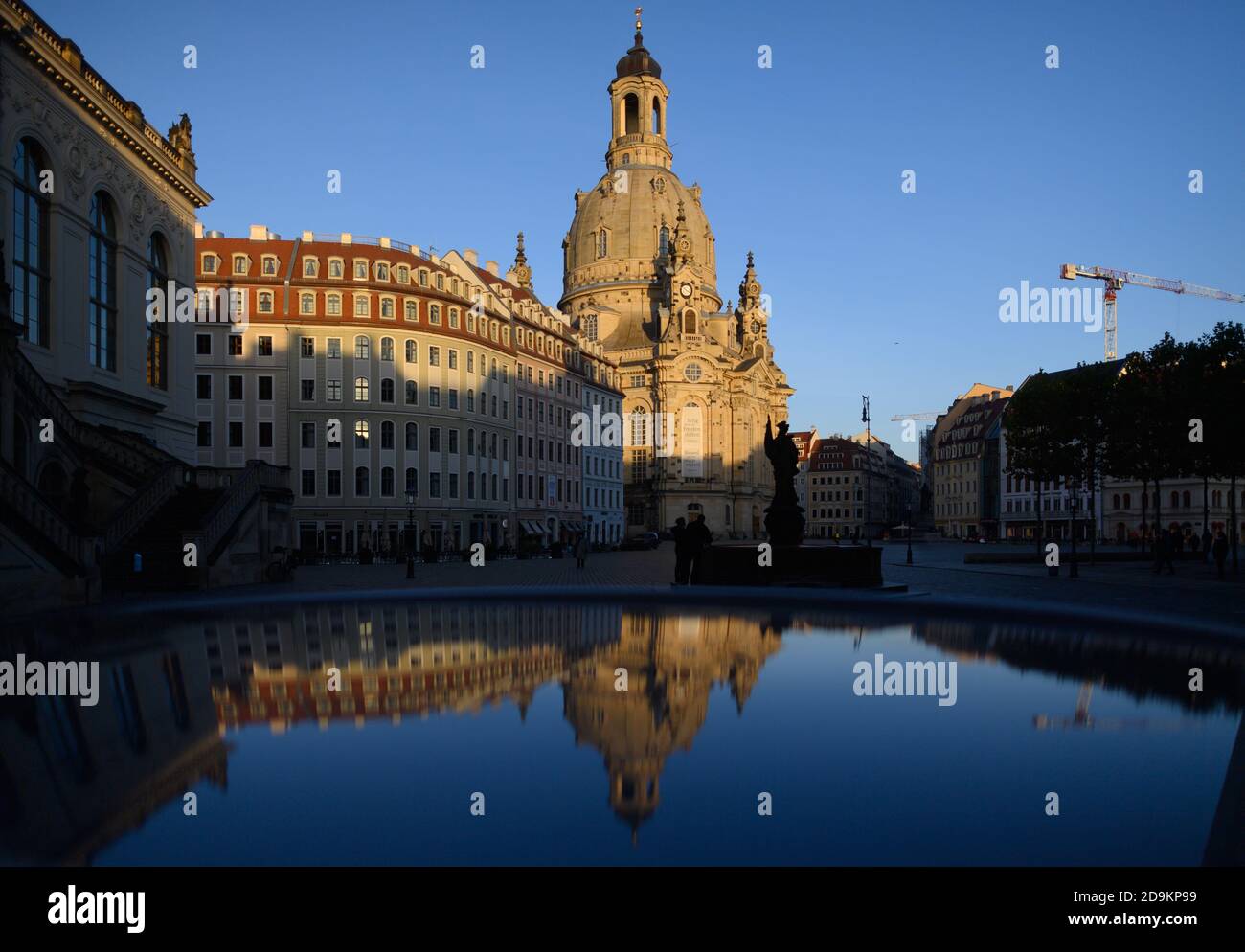 Dresden, Germany. 06th Nov, 2020. The Frauenkirche is reflected in a car roof on the almost deserted Neumarkt. The federal and state governments have decided on a partial lockdown, among other things, restaurants, leisure facilities and cultural institutions will have to close. This still includes the distance requirement and the obligation to wear masks. Credit: Robert Michael/dpa-Zentralbild/dpa/Alamy Live News Stock Photo