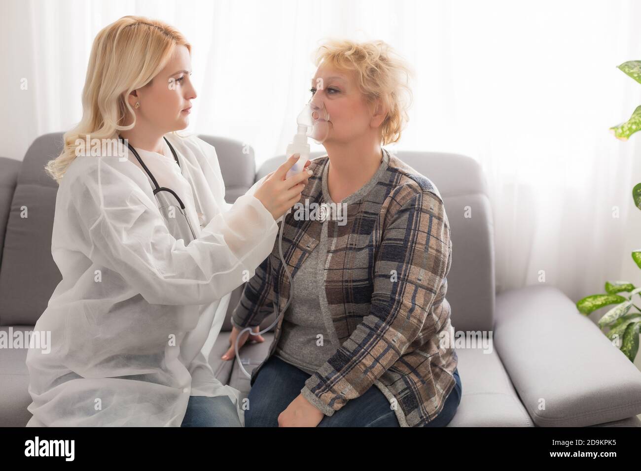 Old woman and the sweet young doctor Stock Photo - Alamy