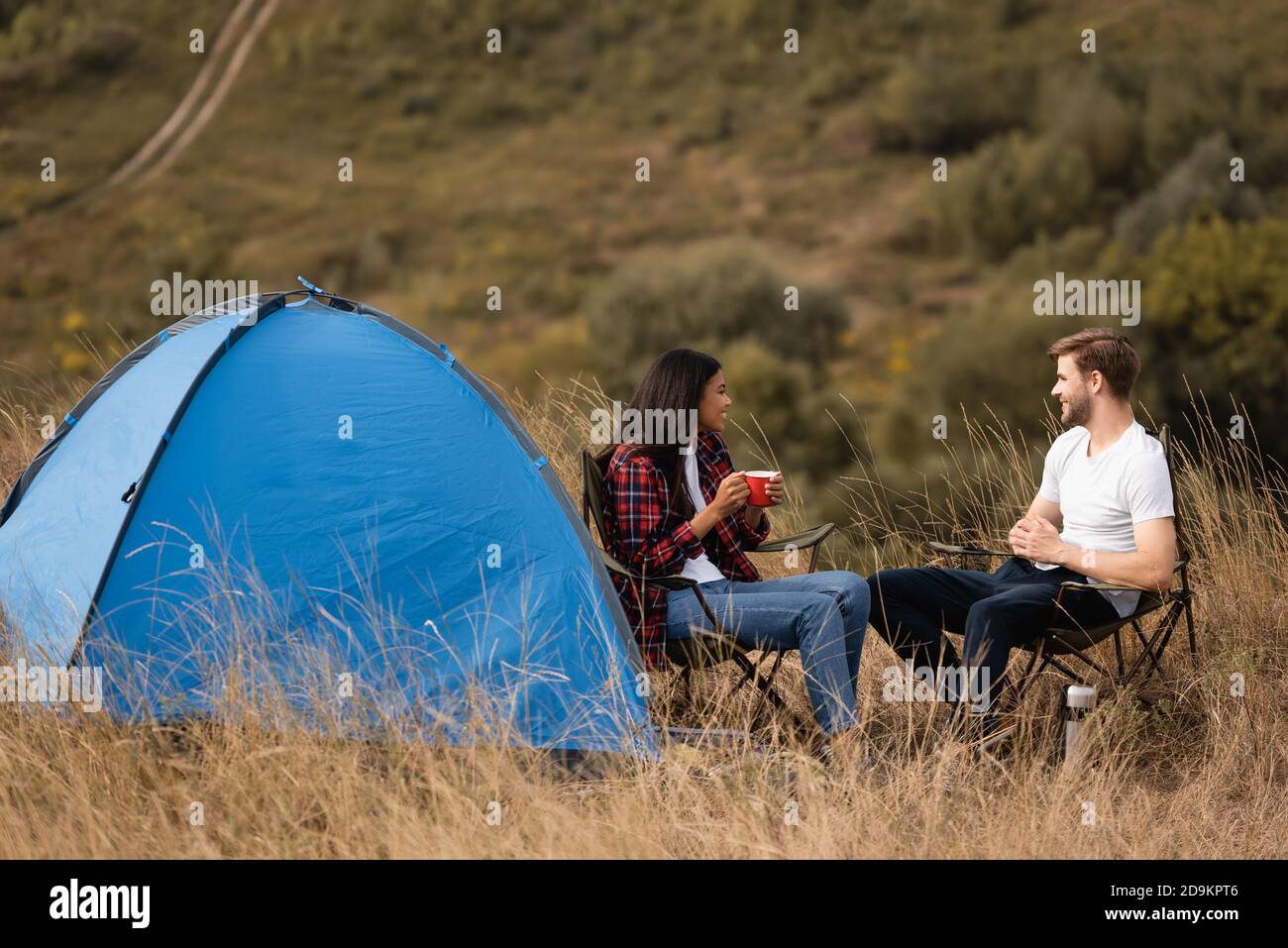 People sitting on camping chairs hi-res stock photography and images ...