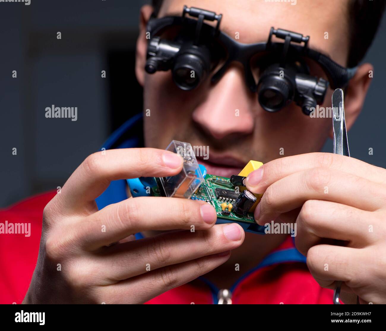 The computer specialist repairing pc late at night Stock Photo - Alamy