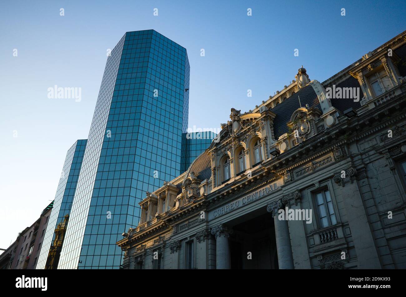View from low angle view of building of National Historical Museum (Museo Historico Nacional) and new business office skyscraper in city centre Stock Photo