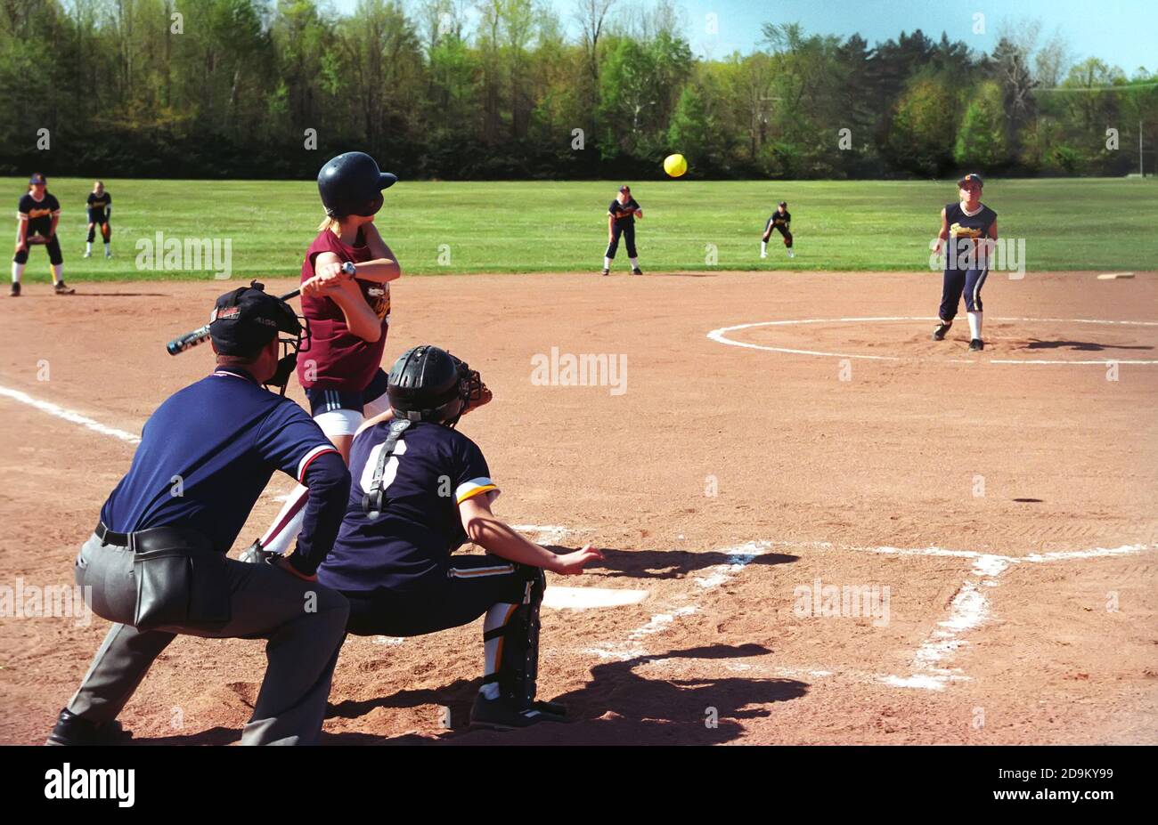 Female hits softball during baseball game Stock Photo Alamy