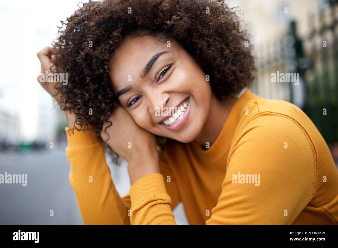 Close up portrait happy young African american woman with curly hair ...