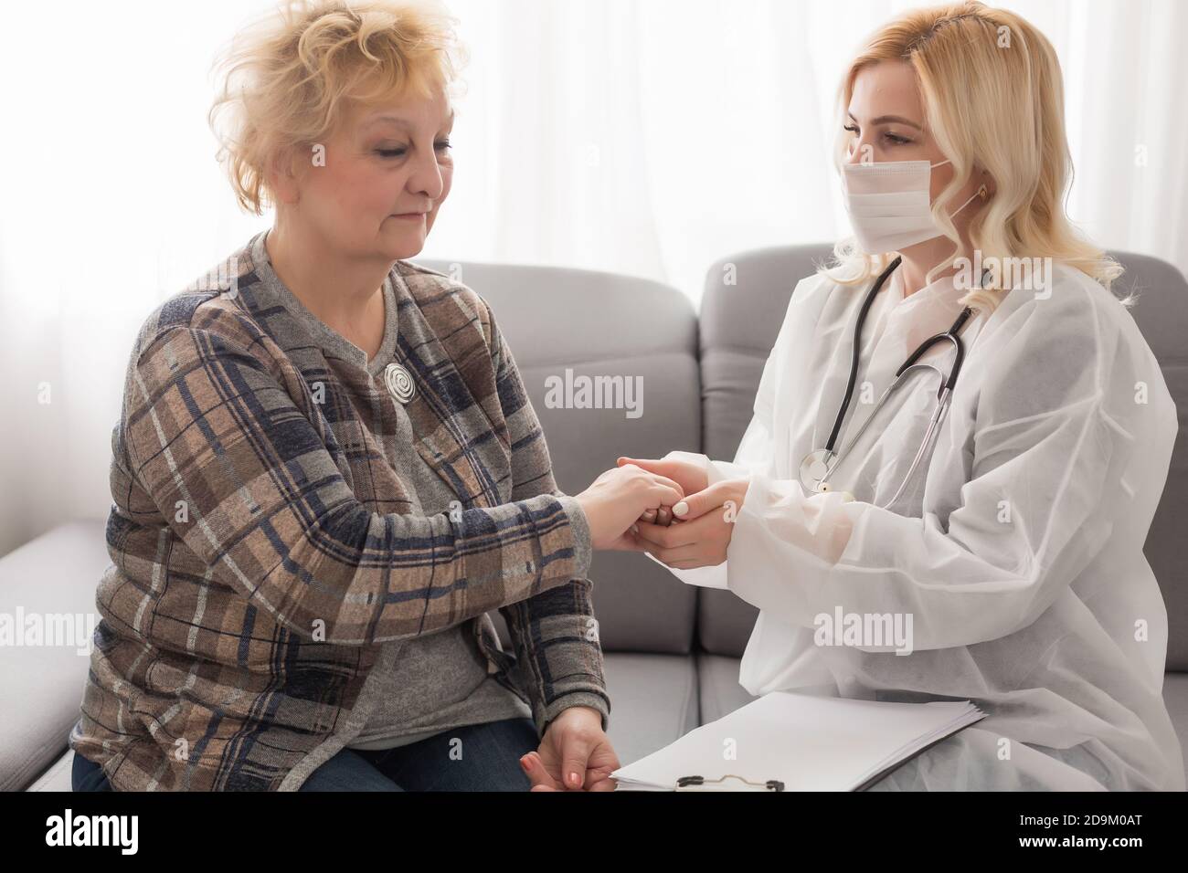Old woman and the sweet young doctor Stock Photo - Alamy