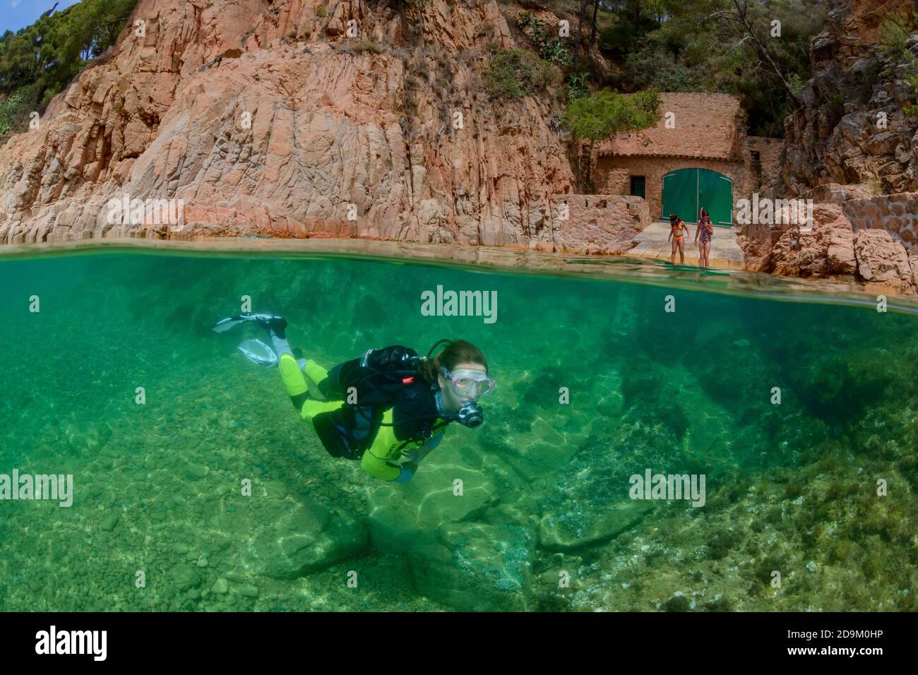 Split level shot of diving on house reef in Tamariu, Costa Brava, Spain, Mediterranean Stock Photo