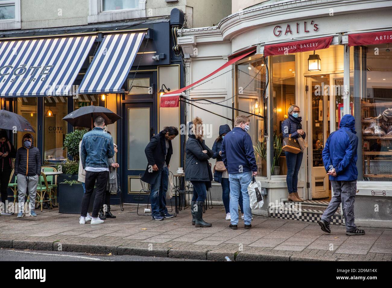 Queues build outside Gail's bakery in Wimbledon Village during the countdown to the second coronavirus lockdown in November 2020 across England, UK Stock Photo