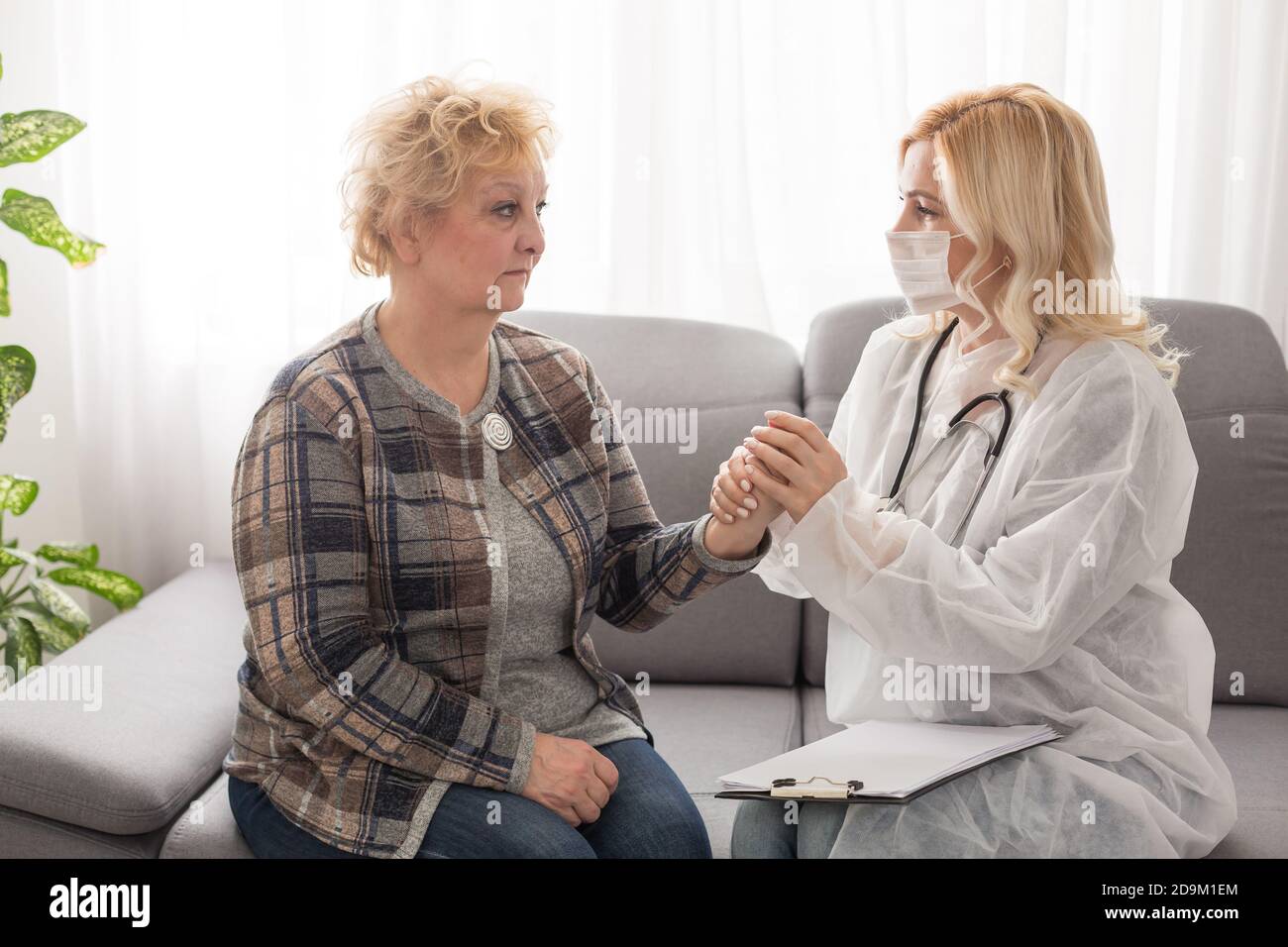Old woman and the sweet young doctor Stock Photo - Alamy