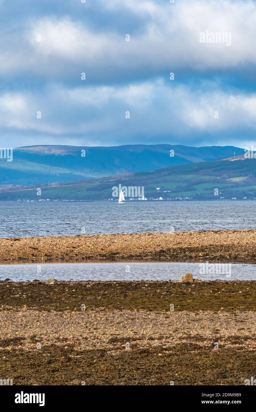 From The town of Largs set on the Firth of Clyde Looking Over to Rothesay and Dunoon in the West of Scotland with a Dramatic winter sky above a White Stock Photo