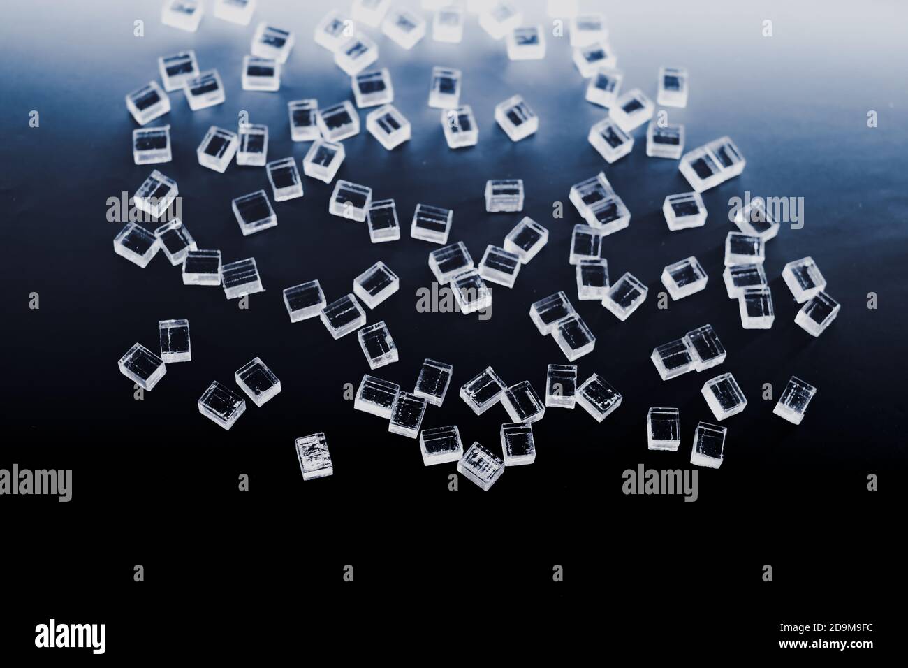 abstract plastic parallelepipedic shapes on a dark background Stock Photo