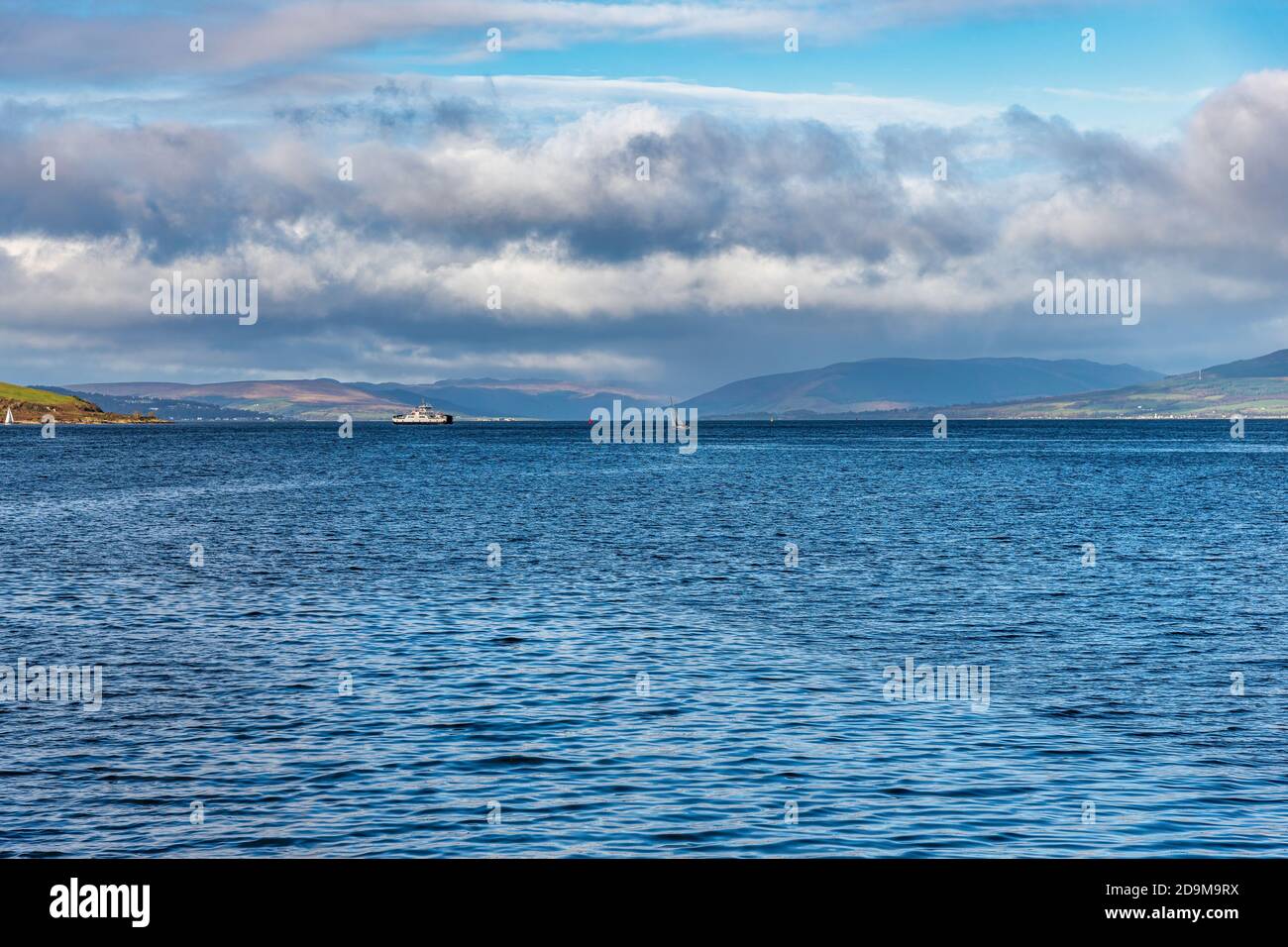 From The town of Largs set on the Firth of Clyde Looking Over to Rothesay and Dunoon in the West of Scotland with a Dramatic winter sky Stock Photo