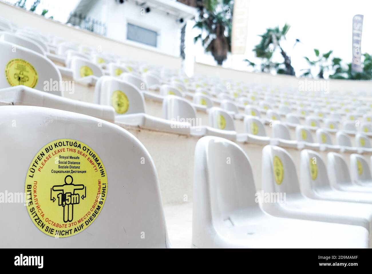 Belek, Turkey - October 2020: Warning sign: leave some seats free for social distancing during coronavirus outbreak. New normal lifestyle in pandemic. Stock Photo