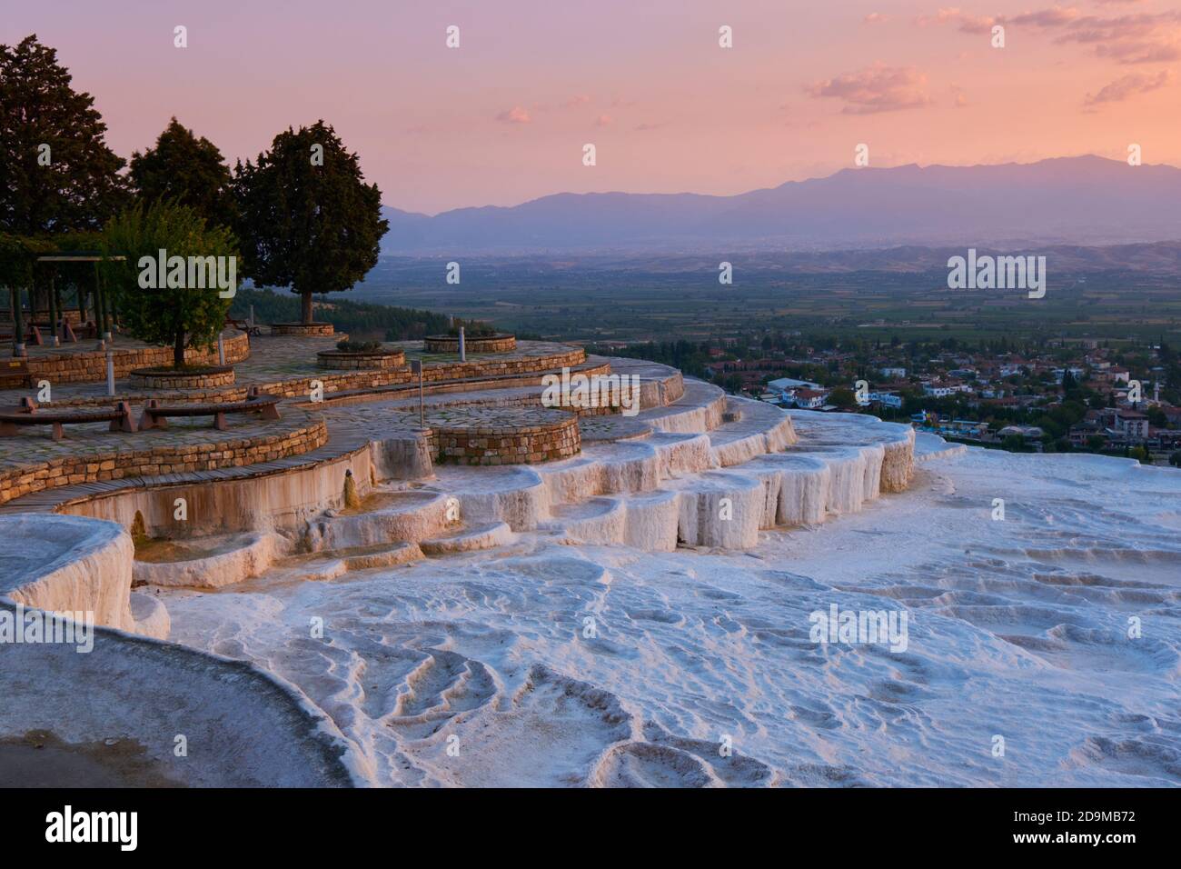 White travertine basins at sunset in Pamukkale, Turkey Stock Photo