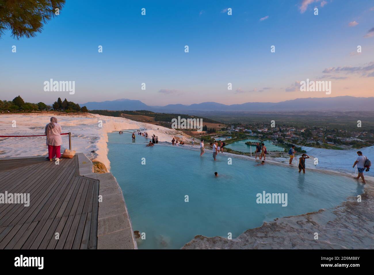 Tourists swim in travertine pools in Pamukkale, Turkey Stock Photo
