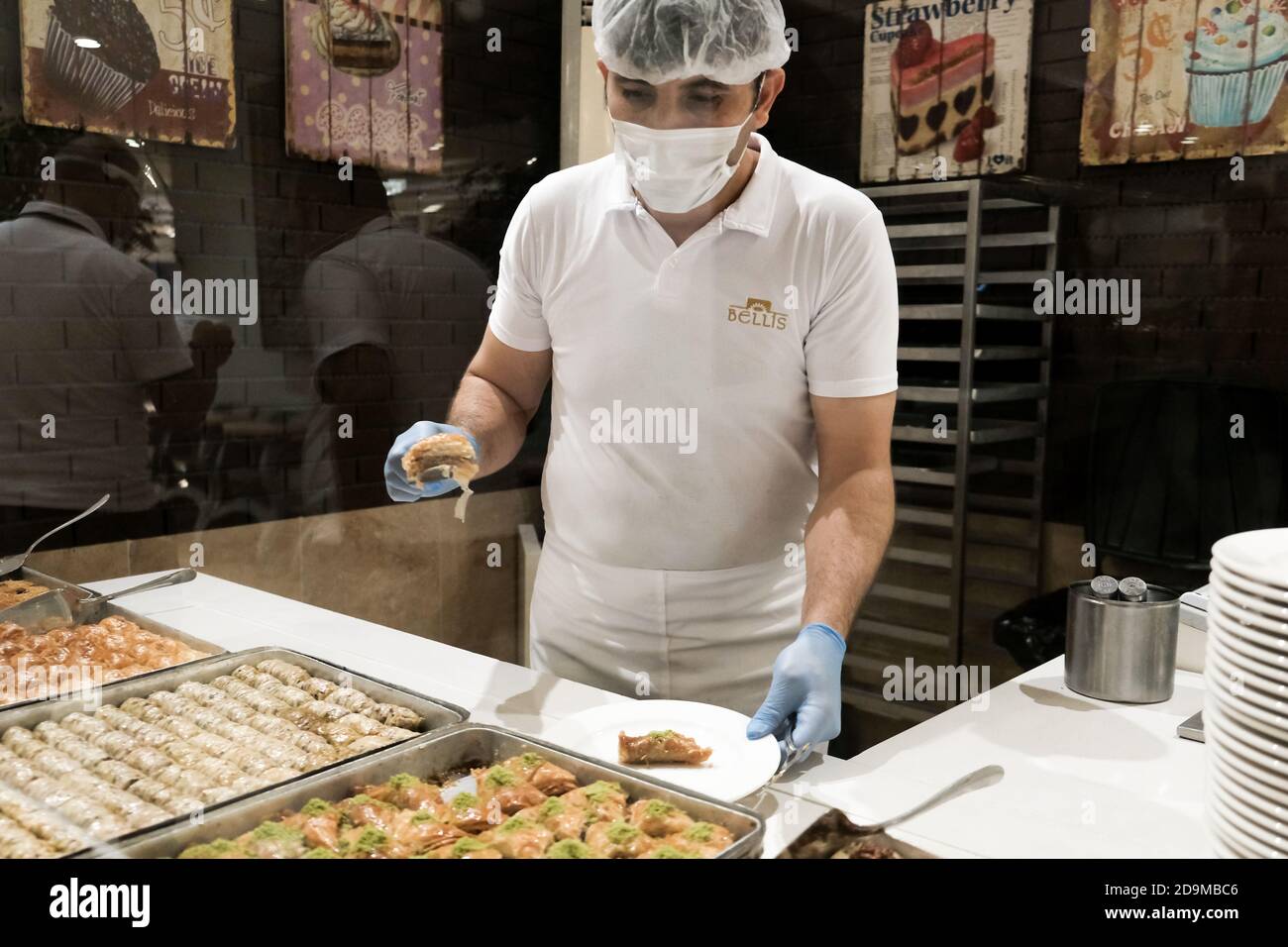 Belek, Turkey October 2020 Hotel staff in gloves, masksserving food