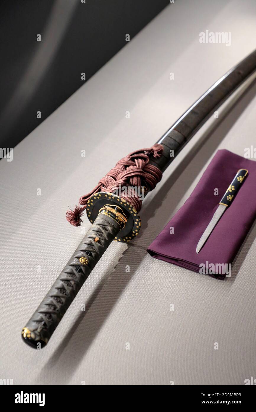 A closed up view of the special decoration of a Japanese sword displaying with a small knife in Japanese Sword Museum.Tokyo.Japan Stock Photo
