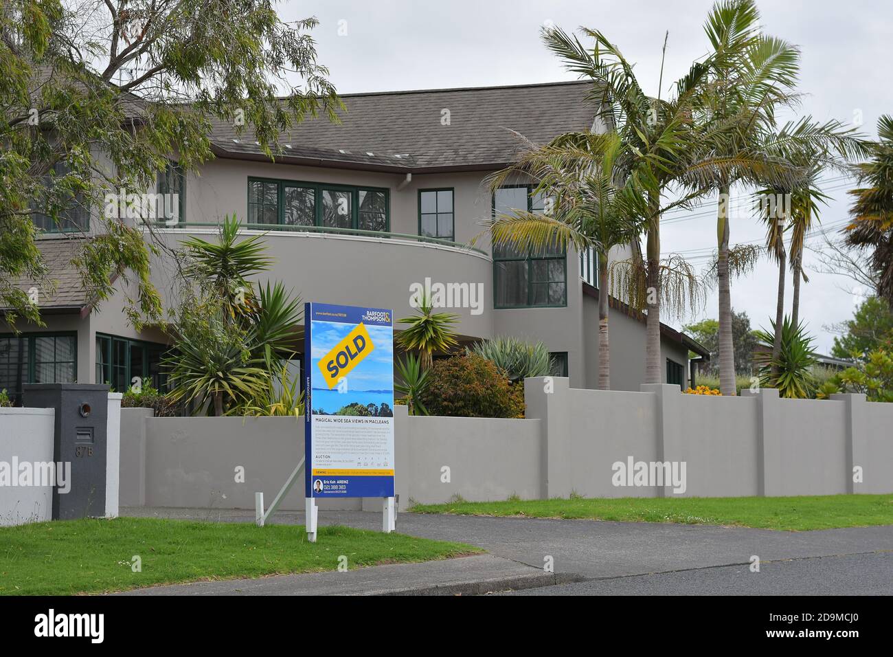 AUCKLAND, NEW ZEALAND Nov 04, 2020 View of suburban house in Howick with Sold sign on cloudy