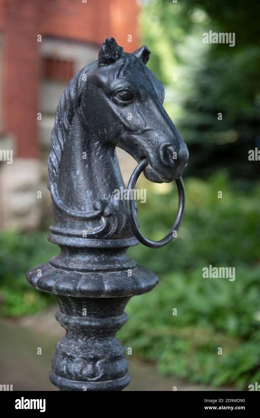 ornate horse hitching post of a horse's head in Pullman Park Stock Photo