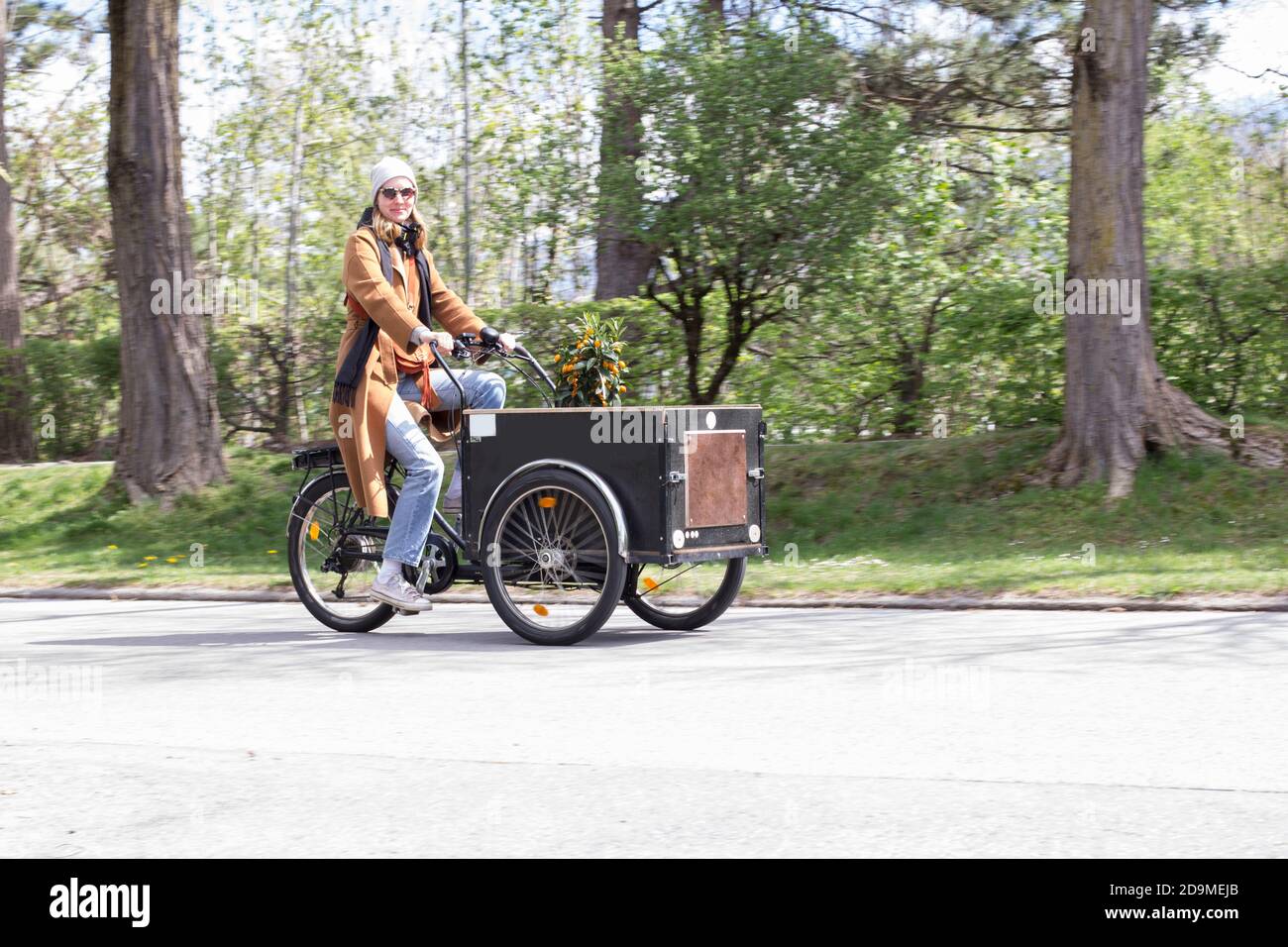 Riding the cargo bike Stock Photo Alamy