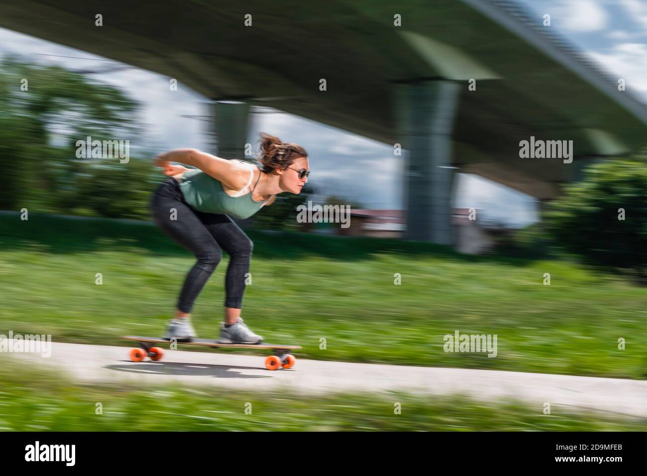 Woman, 24 years, skating in blurred motion, Remstal, Baden-Württemberg, Germany Stock Photo