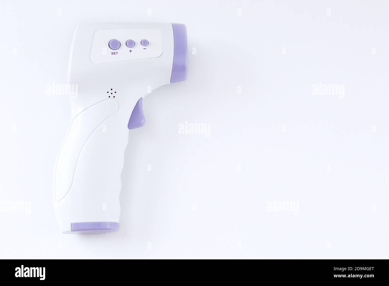 Digital thermometer to check body temperature against white background ...