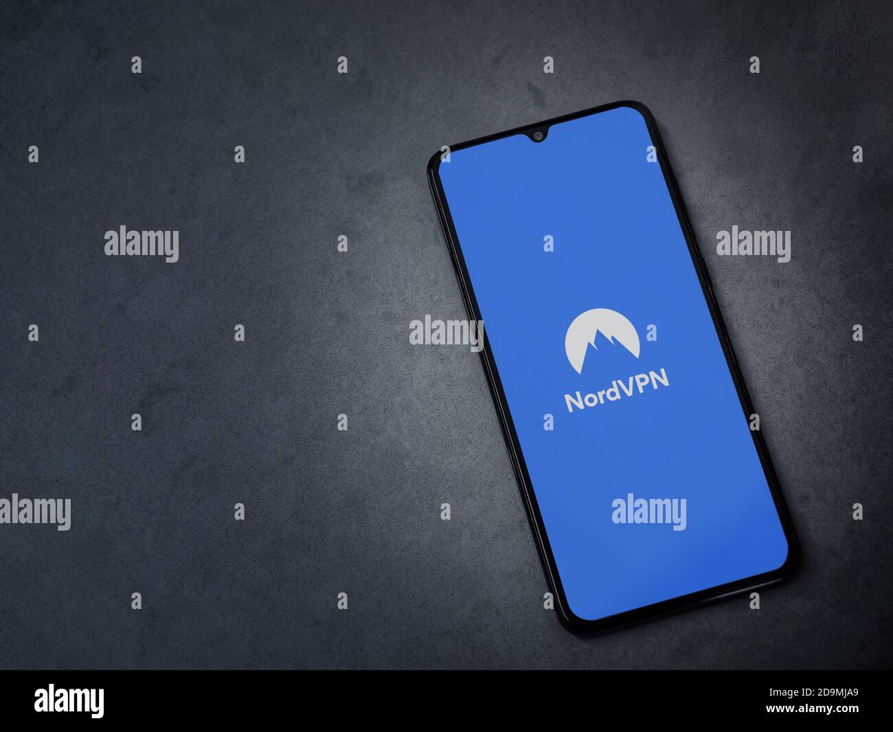 Lod, Israel - July 8, 2020: NordVPN app launch screen with logo on the display of a black mobile smartphone on dark marble stone background. Top view Stock Photo