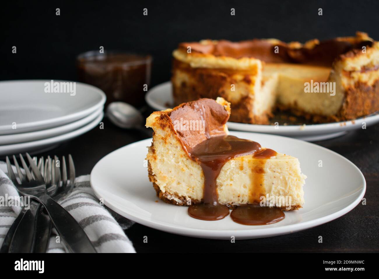 Slice of Eggnog Cheesecake with Rum Caramel Topping A slice of